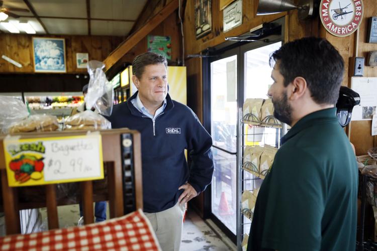 geoff diehl talks with paul Tawczynski in the store at Taft Farms