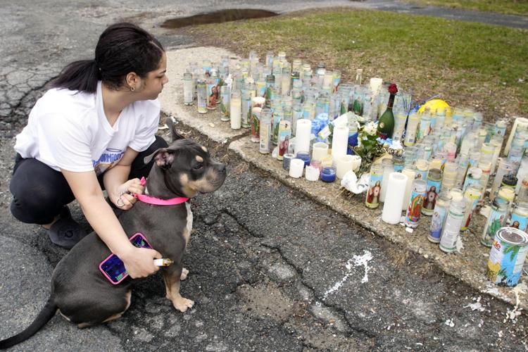 Woman and dog visit memorial (copy)