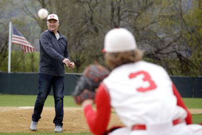 steve messina throws first pitch