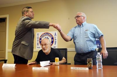 sheriff candidates shake hands