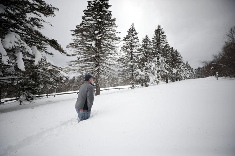Rich Lampron walks through deep snow