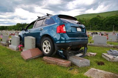 Car hits cemetery stones in north adams