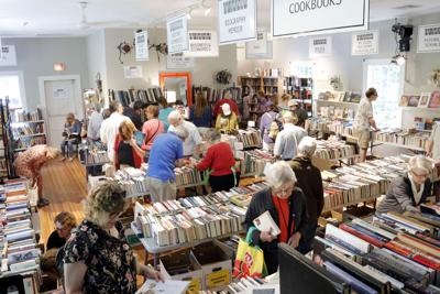 People search for book at a book fair