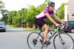 Female biker riding road bike