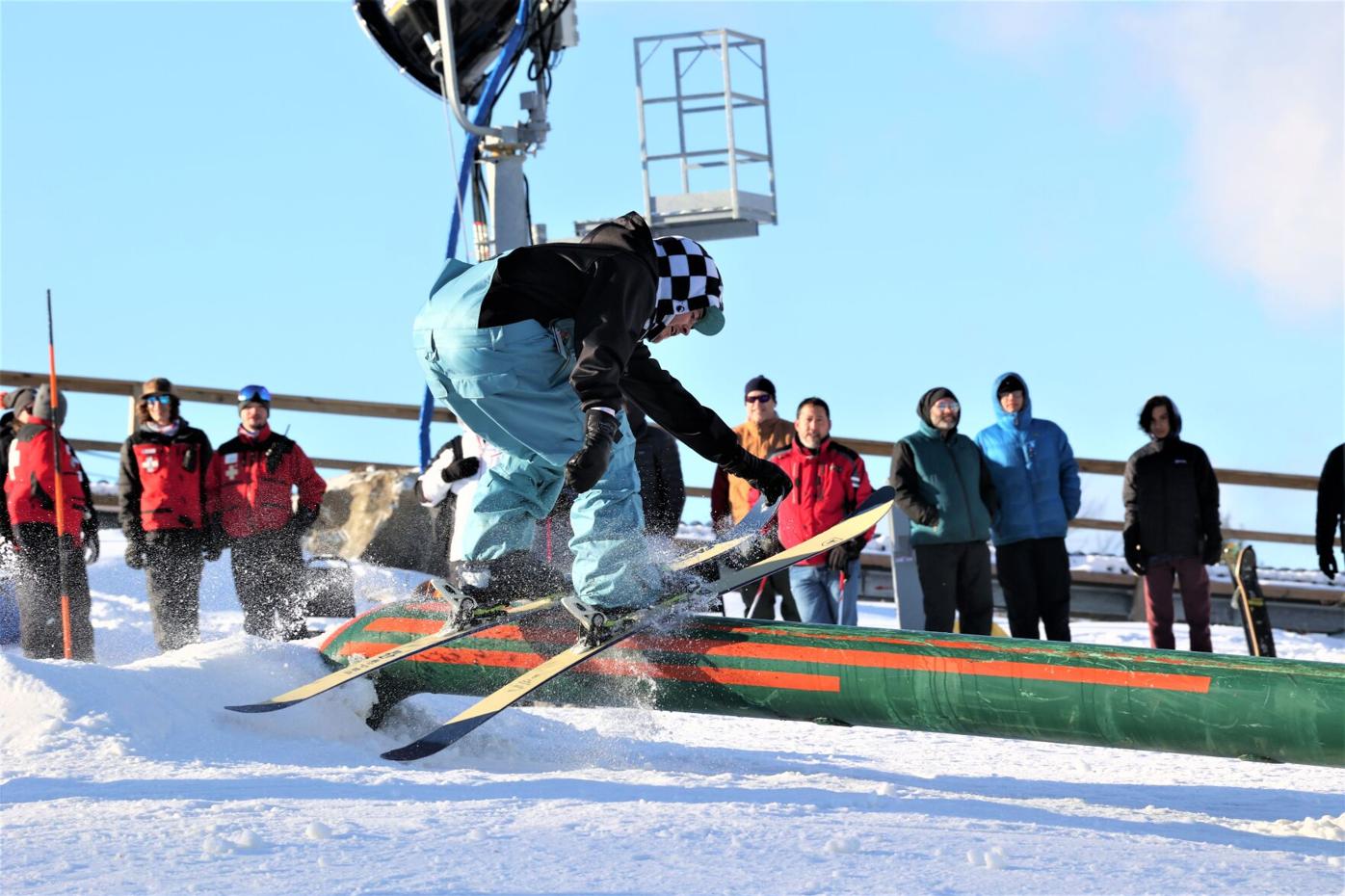 skiers ride rails at Bousquet