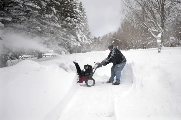 Gary Poulton pulls snowblower
