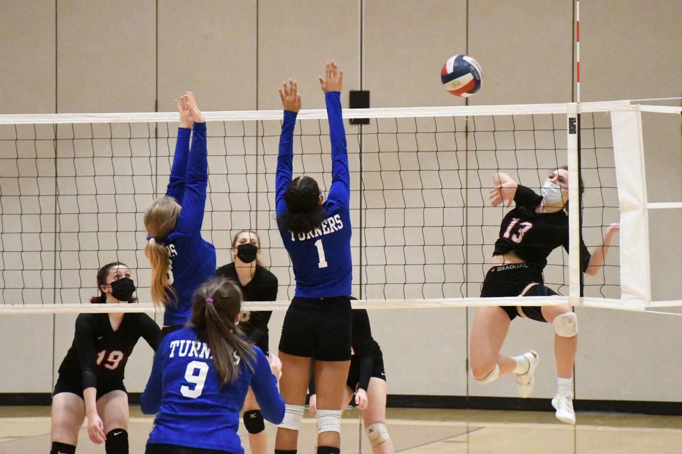 Darrow spikes the ball