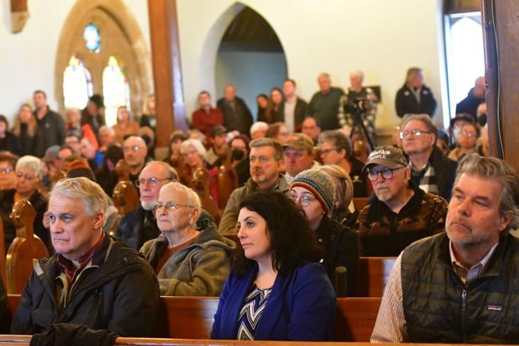 People fill a church for a meeting