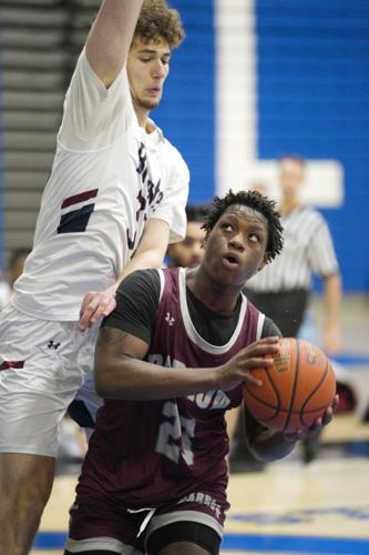 Brewster #32 Sawyer Mayhugh defends against Darrow #23 Mo Sylla