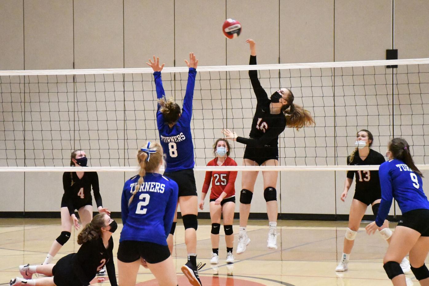 Savage spikes the ball