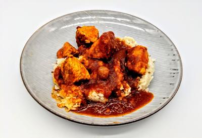 Chicken Tikka masala and rice on a plate