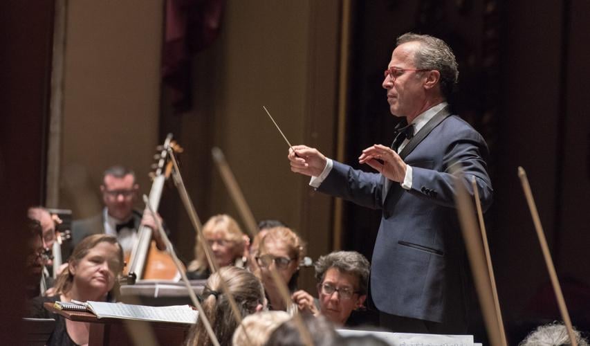 A man conducts an orchestra