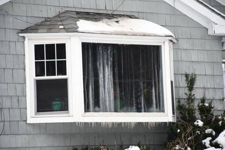 The front window shows fire damage