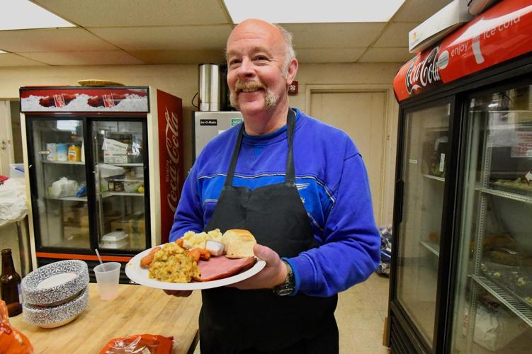 American Legion volunteers serve up free Christmas dinner for anyone in