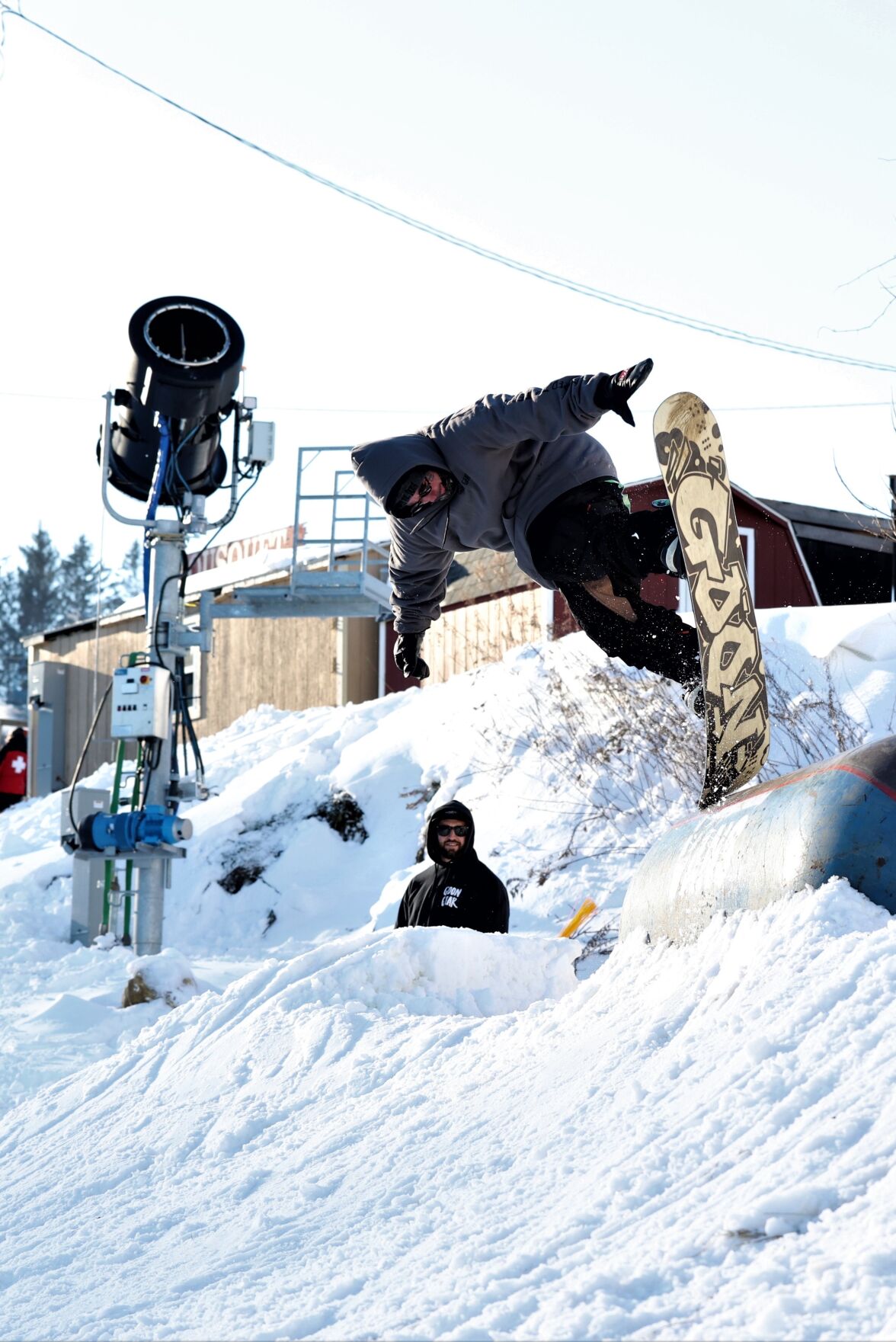 snowboarder hits a jump at Bousquet