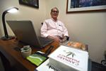 Dr. Stephen Tracy behind his desk at Berkshire Cannabis Connect in Pittsfield