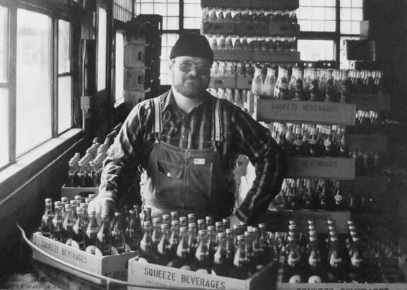 Ted Gwozdz with soda bottles