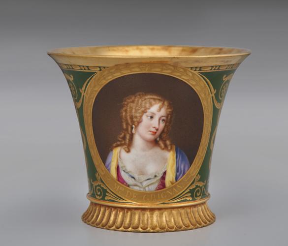 Cup with painting of woman on it