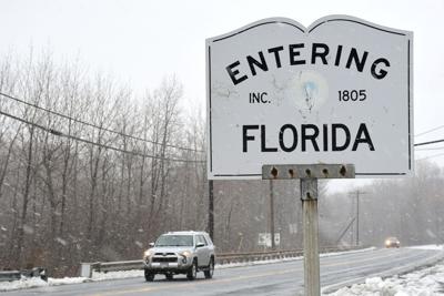 Motorists traverse Route 2 at the Entering Florida sign
