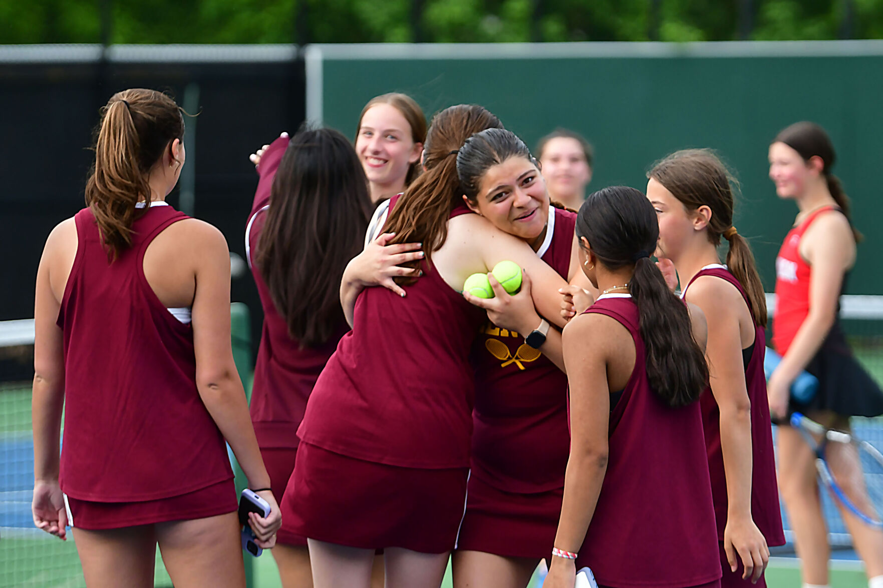 Players congratulate their team