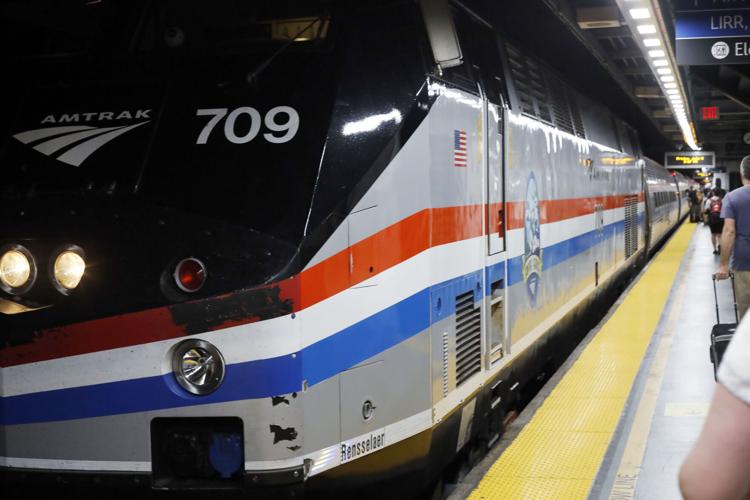 passengers board amtrak train