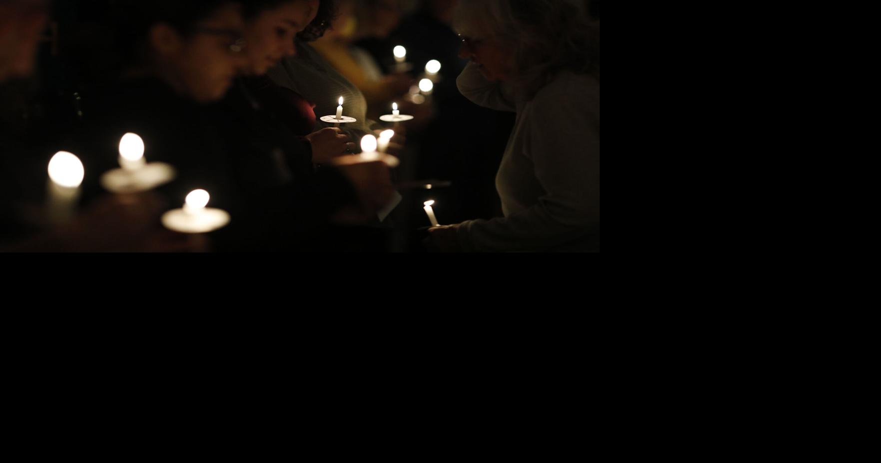 At a candlelight vigil for those who lost their lives to domestic ...