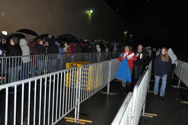 Shoppers lined up with barricades outside store