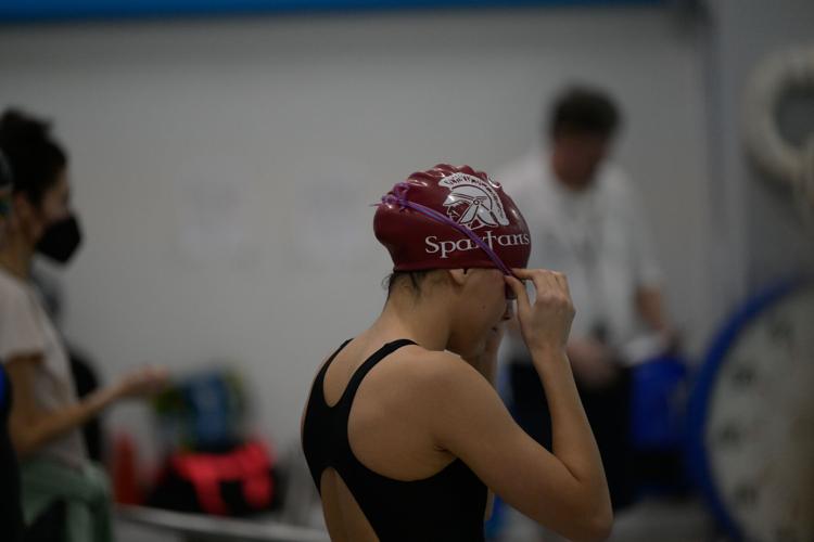 swimmer adjust goggles