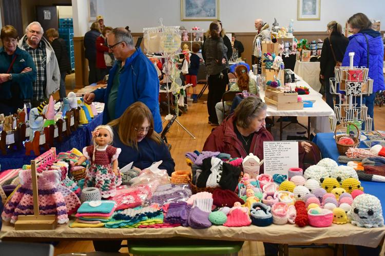 People check out vendors at a craft fair