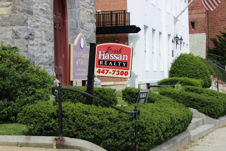 Hassan Realty sign in front of First Church