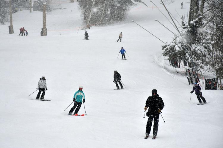People ski and snowboard at Jiminy Peak