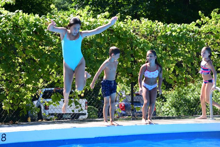 Kids jump in the pool