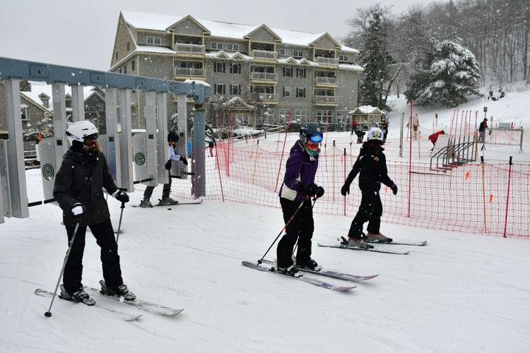 People goes through the gate at Jiminy Peak