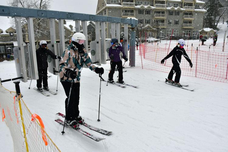 People goes through the gate at Jiminy Peak