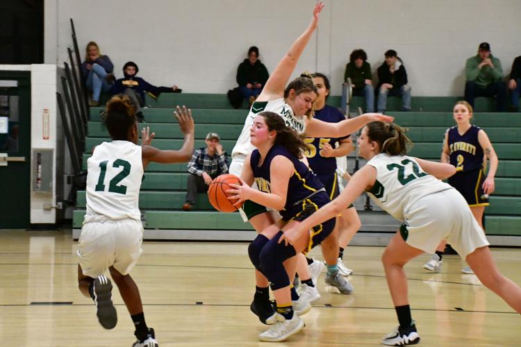 Girls play basketball