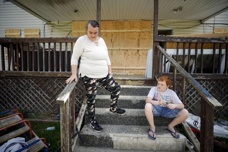 jessica and owen thomas on porch of destroyed house