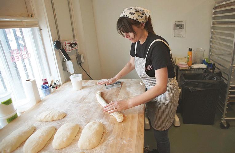 Alex Oster rolls dough