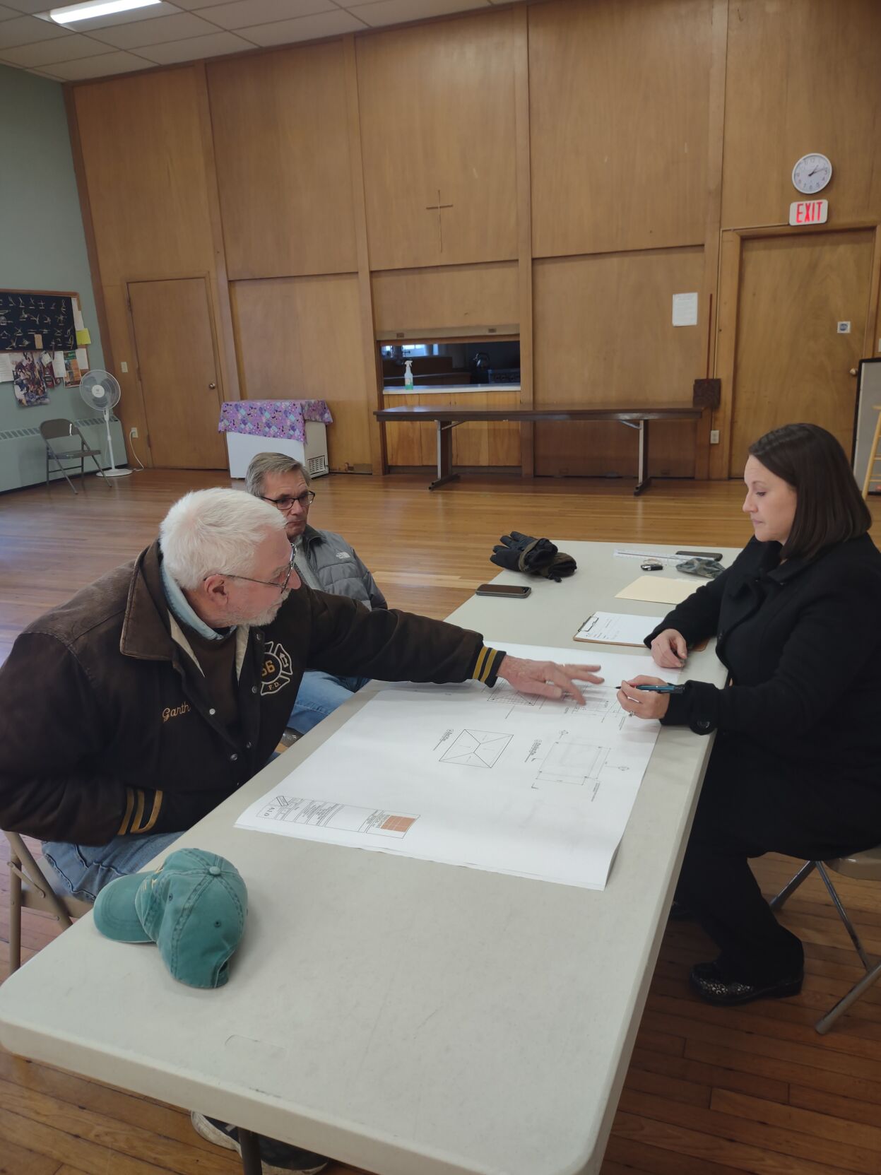 Garth Story David Markham and architect Kerry Bartini review plans for pavilion at the First Congregational Church park in Lee