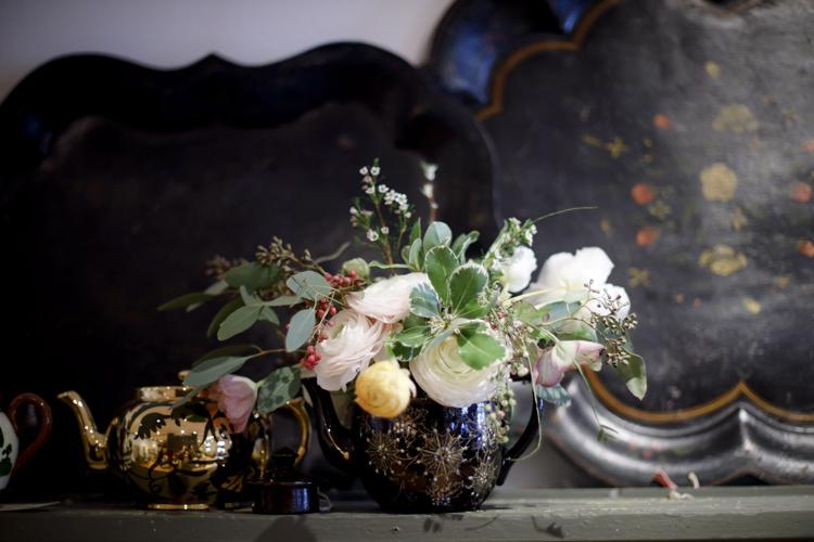 flower arrangement in teapot