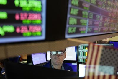 Investor beneath market screens