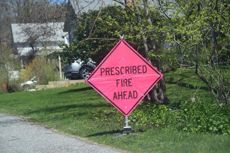 A sign says Prescribed Fire Ahead