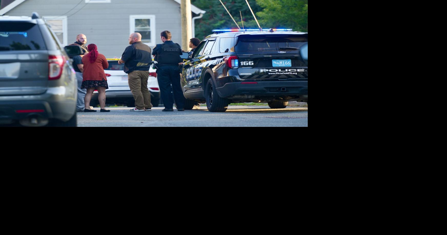 police speak with a woman