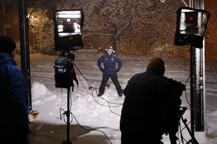 camera crew shoots jim cantore weather report
