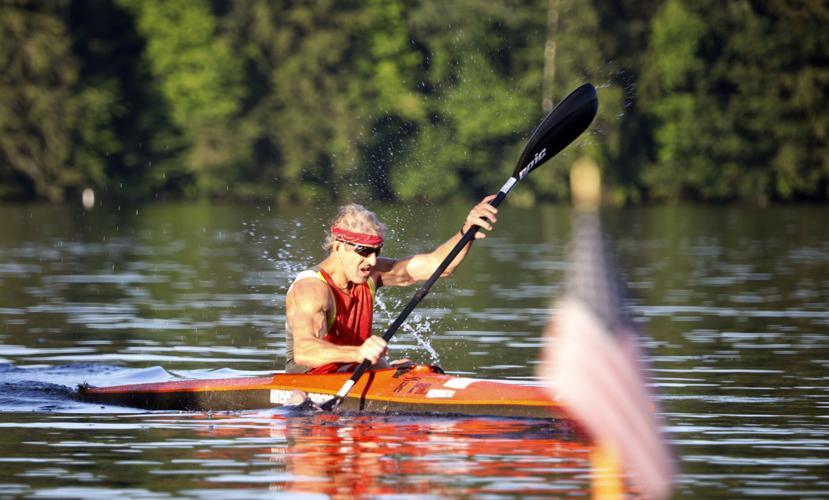 Kurt Kuehnel paddles in red kayak