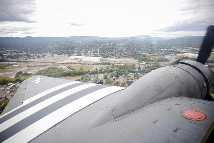 view of the berkshires from wing of vintage wwii cargo plane