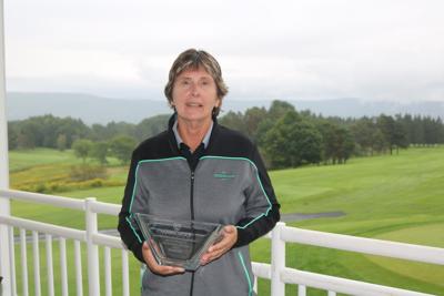 Diane Breen holds her trophy