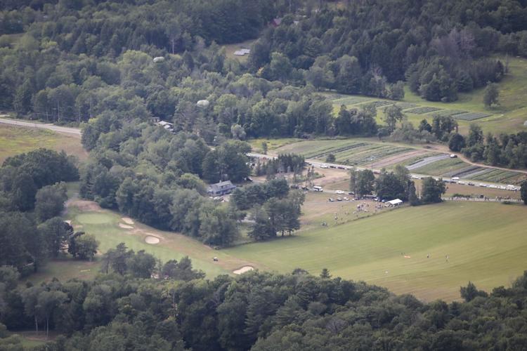 parachuters head toward open field