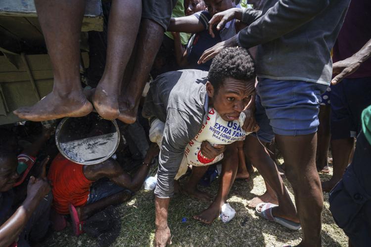 A man carries rice