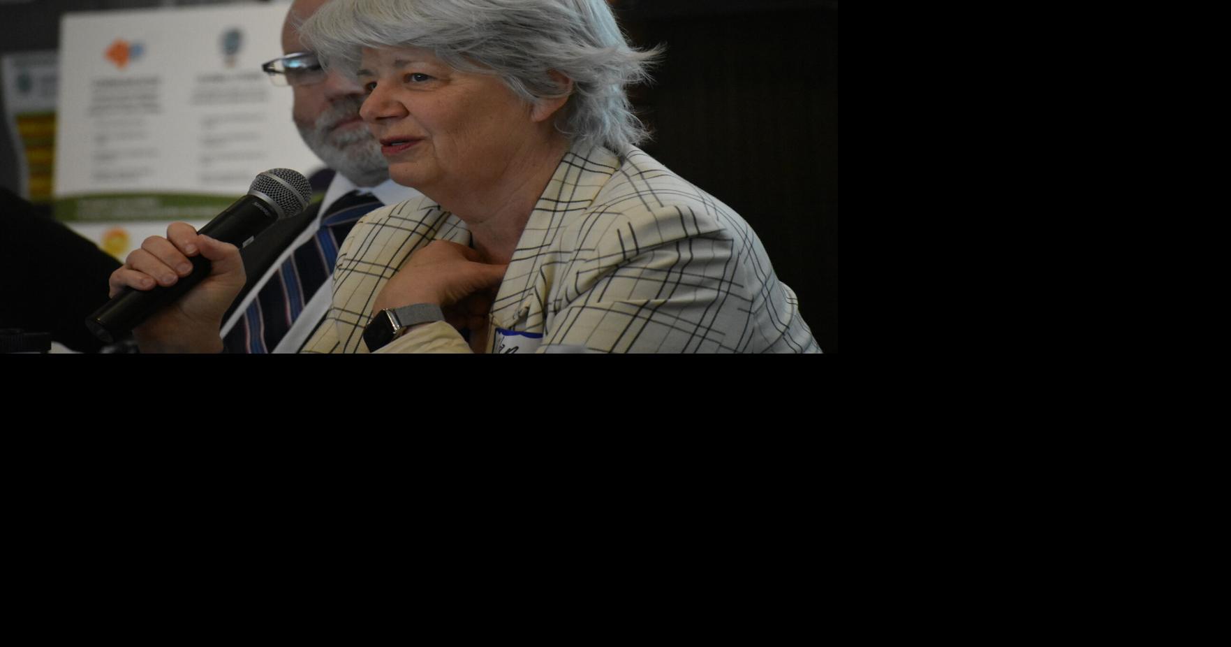 Who will administer and score end-of-course exams if they replace MCAS as high school graduation requirements?