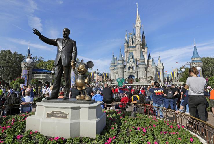 Disney statue and Castle in Orlando